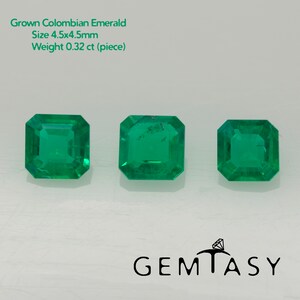 May include: Three vibrant green, emerald-cut gemstones. The gems are a vivid green color and have a rectangular shape with beveled edges. The text in the image reads: Grown Colombian Emerald, Size 4.5x4.5mm, Weight 0.32 ct (piece). The logo for Gemtasy is at the bottom.