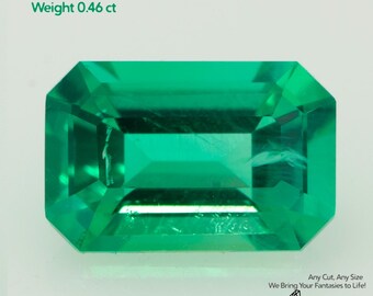 May include: A vibrant, emerald-cut, green Colombian emerald gemstone. The gem is rectangular with beveled edges. Text indicates the size is 6x4mm and the weight is 0.46 ct. The image includes the Gemtasy logo and the text "Any Cut, Any Size".
