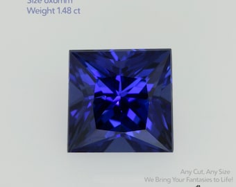 May include: A square-cut, royal blue sapphire gemstone. The text in the image reads: "Grown Sapphire Royal Blue, Size 6x6mm, Weight 1.48 ct." The gemstone is a deep, vibrant blue with facets that reflect light. The image also includes the text "Any Cut, Any Size, We Bring Your Fantasies to Life!" and the logo "GEMTASY".