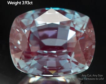 May include: A lab-grown alexandrite gemstone with a cushion cut. The gem is a mix of pink and blue hues, with a size of 10x8mm and a weight of 3.93ct. The image also includes the text "Any Cut, Any Size" and "We Bring Your Fantasies to Life!" and the logo "GEMTASY".