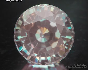 May include: A lab-grown Alexandrite gemstone, 8mm in size and weighing 2.66 ct, is shown. The round-cut gem has a multifaceted surface with light pink and teal reflections. The image includes the text "Alexandrite lab-grown", "Size 8mm", and "Weight 2.66 ct".