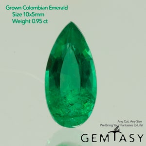May include: A vivid, pear-shaped, emerald-green gemstone. The image includes text indicating it's a grown Colombian emerald, measuring approximately 10x5mm, and weighing 0.95 ct. The Gemtasy logo is visible.