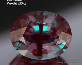 May include: An oval, lab-grown alexandrite gemstone. The gem is a deep burgundy color with flashes of teal and measures 10x8mm. The weight is 3.10 ct. The image includes the text "Alexandrite lab-grown Size 10x8mm Weight 3.10 ct."
