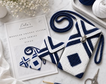 May include: A navy blue and white crocheted crossbody phone pouch and a matching square coin purse. The items feature a geometric pattern, a silver metal clasp, and a long strap. A pattern booklet, yarn balls, and a 3.0mm crochet hook are present.