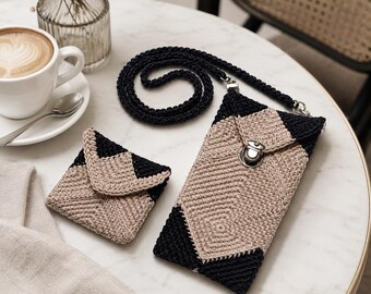May include: A crochet crossbody phone pouch and a matching small square coin purse, both featuring a geometric pattern in black and beige yarn. The phone pouch includes a long black crochet strap and a silver-toned metal clasp closure.