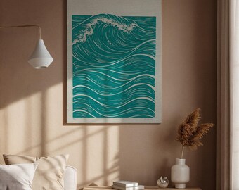 May include: Teal and white wave art print on a canvas-like background. The artwork depicts a stylized ocean wave with detailed lines, creating a sense of movement. The print is framed with a neutral border, suitable for coastal or minimalist decor.