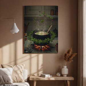 May include: A framed print depicts a black cauldron bubbling over a small fire, surrounded by fresh herbs. Steam rises from the pot, suggesting a magical brew. The scene is set in a rustic kitchen, with a wooden spoon in the pot.