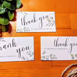 May include: Three white cards with the text "thank you for supporting my small business" and a watercolor design of green leaves.