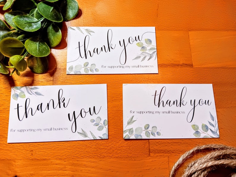 May include: Three white cards with the text "thank you for supporting my small business" and a watercolor design of green leaves.
