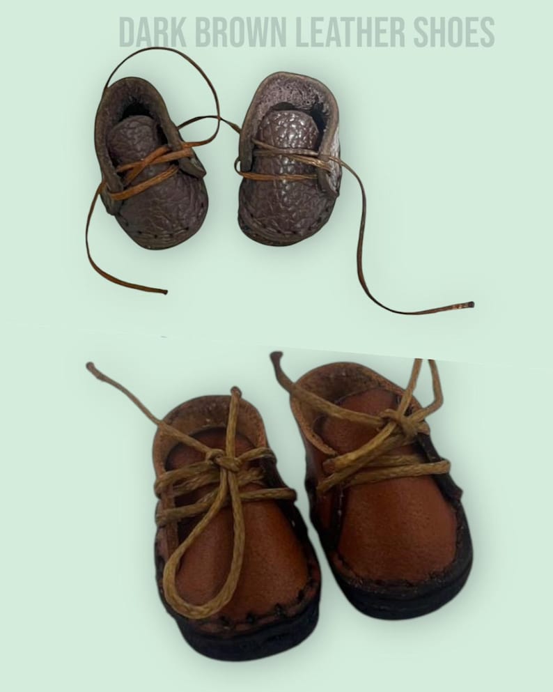 May include: Two pairs of dark brown leather shoes with brown laces. The shoes are tied with a bow. The shoes are small and appear to be for a doll or a child.