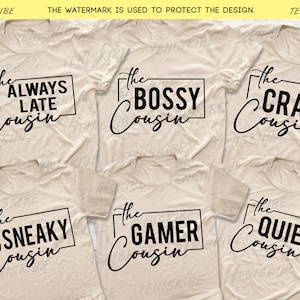 May include: Six beige t-shirts with black text. Each shirt has a different phrase, including "The Always Late Cousin", "The Bossy Cousin", "The Crazy Cousin", "The Sneaky Cousin", "The Gamer Cousin", and "The Quiet Cousin".