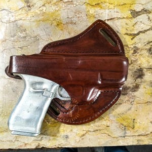 Hand Molded OWB Leather Holster for Perfect Fit and Security with Steel Thumb Break for Kimber, CZ, Ruger, Smith & Wesson and HK Models.