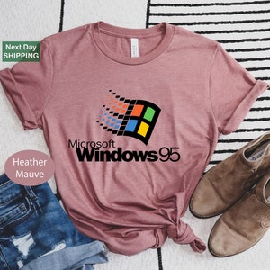 a pink t - shirt with the microsoft 95 logo on it