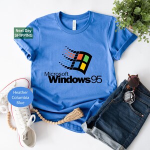 a blue t - shirt with a microsoft logo on it