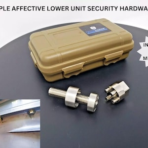 May include: A tan, rectangular case with a silver and stainless steel security hardware set. The set includes a bolt, a nut, and a unique locking mechanism. Text on the case reads "SIMPLE AFFECTIVE LOWER UNIT SECURITY HARDWARE!" and "INSTALLS IN MINUTES!"