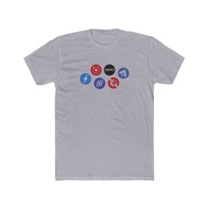 May include: A heather grey t-shirt with a variety of logos printed on the front, including "DIMO", "f", and a red circle with a white dot in the center.