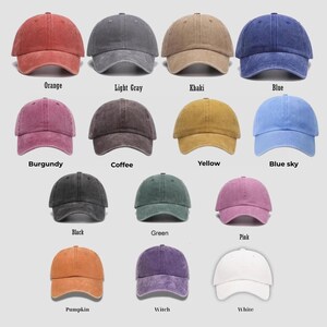 May include: A collection of baseball caps in various colors, including orange, light gray, khaki, and blue. Other colors are burgundy, coffee, yellow, blue sky, black, green, pink, pumpkin, witch, and white. Each cap has a curved brim.