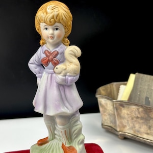 Vintage porcelain figurine Girl with Squirrel, France