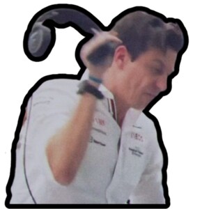 May include: A man wearing a white racing uniform with red and black accents, holding a black headset over his ear.