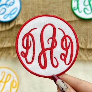 May include: A white ceramic mug with a black handle and the text "But First, Coffee" in a bold, black font. The mug is set against a neutral background, highlighting its simple design.