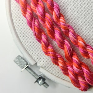Hand dyed embroidery floss for cross stitch and needlework, pink and orange variegated