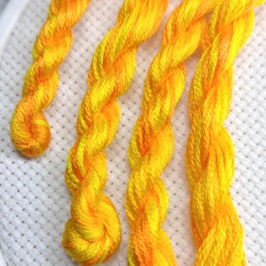 Hand dyed embroidery floss for cross stitch and needlework, yellow and orange variegated