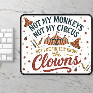 May include: A rectangular mousepad with a black border and a white surface. The mousepad features the text "NOT MY MONKEYS NOT MY CIRCUS BUT I DEFINITELY KNOW the Clowns" in a circus-themed design with a circus tent, stars, and clown hats.