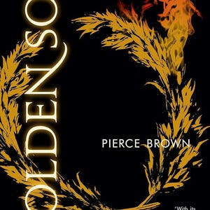 Può includere: Copertina del libro "Golden Son" di Pierce Brown. Il titolo è in grandi lettere dorate luminose. Una corona d'alloro dorata circonda il titolo. Il nome dell'autore è sotto. Lo sfondo è nero, con fiamme in alto.