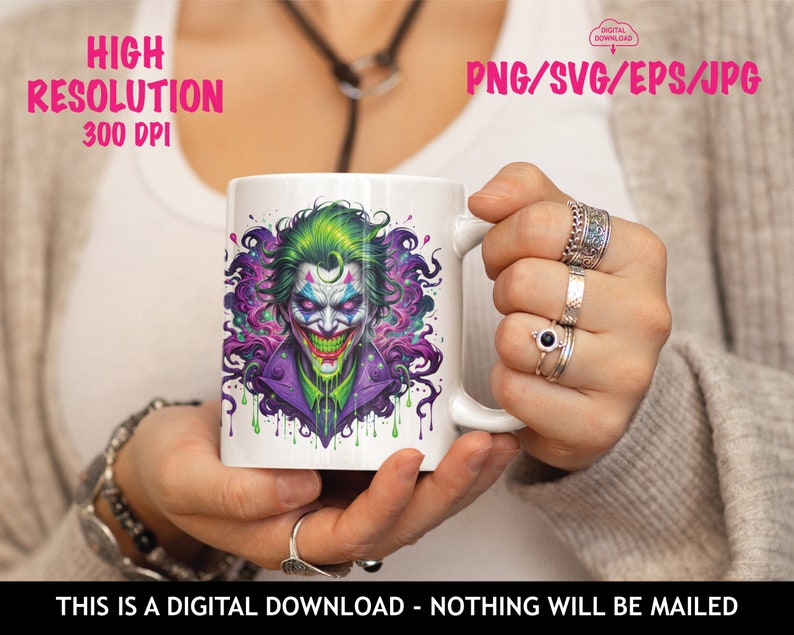 May include: A white mug featuring a colourful illustration of the Joker from Batman. The Joker is depicted with green hair, purple and green clothing, and a dripping green smile. The background is a purple and green swirl.