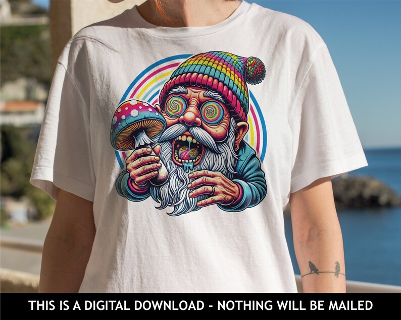May include: White t-shirt featuring a colorful cartoon illustration of a psychedelic gnome holding a mushroom. The gnome has swirling eyes and a rainbow-colored hat. The text at the bottom reads: THIS IS A DIGITAL DOWNLOAD - NOTHING WILL BE MAILED.