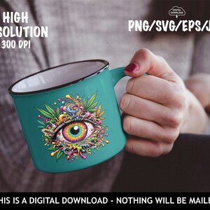 May include: A teal blue mug with a black rim features a colorful psychedelic eye design with a rainbow iris and green marijuana leaves. The design is surrounded by colorful swirls and drips.