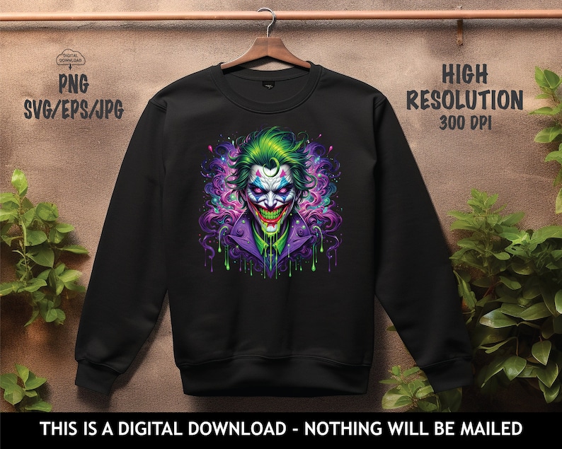 May include: Black sweatshirt featuring a colourful graphic of the Joker, a character from the Batman comics. The Joker is depicted with green hair, a purple suit, and a green and purple background.