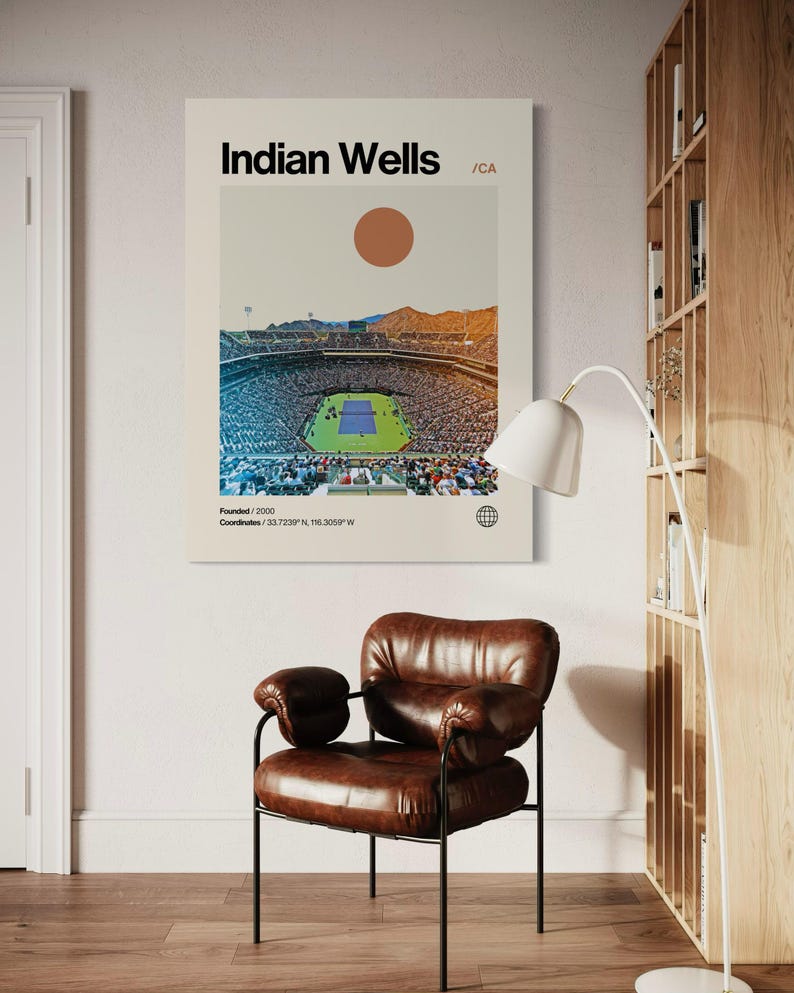 May include: A minimalist poster with a white background featuring a graphic of a stadium with a tennis court in the center. The text "Indian Wells /CA" is at the top of the poster. The text "Founded/2000" and "Coordinates/33.7239&deg;N, 116.3059&deg;W" is at the bottom of the poster.