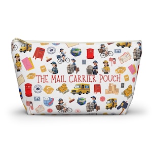 May include: A white zippered pouch with a repeating pattern of mail carriers, mail trucks, mailboxes, and stamps. The text "THE MAIL CARRIER POUCH" is printed in red across the center of the pouch.