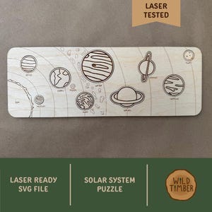 May include: A wooden solar system puzzle with laser-etched planets, including Venus, Earth, and Saturn. The puzzle is rectangular and features the text "LASER READY SVG FILE" and "SOLAR SYSTEM PUZZLE". The image also includes the text "LASER TESTED" and the "WILD TIMBER" logo.
