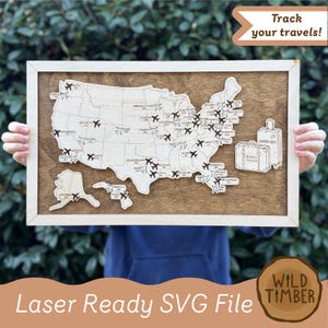 May include: Wooden travel map of the United States with airplane icons marking destinations. The map is framed in light wood and includes the text "Track your travels!" and "Laser Ready SVG File".