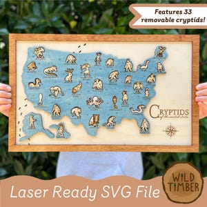 May include: Wooden framed map of the United States with a blue background and 33 removable cryptid figures. The text "Features 33 removable cryptids!" is at the top. The words "Cryptids of the united states" are at the bottom.