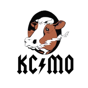 May include: A white t-shirt design featuring a brown and white cow head smoking a cigarette, with smoke rising from its mouth. The text "KC⚡️MO" is displayed in a black, stylized font below the cow's head.