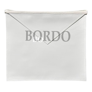 May include: A white apron with the word "BORDO" printed in gray. The apron has a triangular flap at the top and a stitched border. A white fabric band is sewn along the top edge.