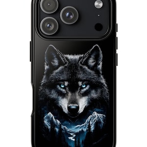 May include: Black phone case featuring a detailed illustration of a wolf with piercing blue eyes. The wolf is set against a backdrop of a mountain landscape with a river. The case has a glossy finish and a black border.