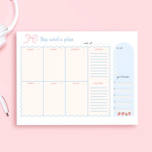 May include: A weekly planner with a light pink background. The planner has a light blue border and text that reads "this week's plan". It includes sections for each day of the week, priorities, to-do list, and a goal tracker.