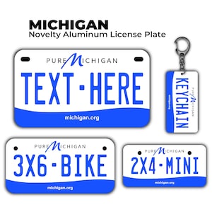 May include: A collection of novelty aluminum license plates and a keychain. The plates are white with blue accents and text, including "TEXT-HERE", "3X6-BIKE", and "2X4-MINI". The keychain reads "KEYCHAIN". The text "MICHIGAN" is at the top.