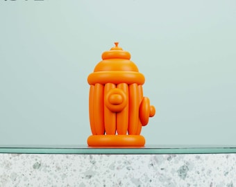 May include: Orange 3D printed model of a fire hydrant. The model is made up of several rounded segments, giving it a balloon-like appearance. The model is sitting on a white countertop with a speckled pattern.