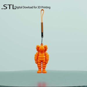 May include: Orange figurine with a loop and strap, suspended against a light background. The figurine is a stylized character with a round head and a distinctive pose. The text ".STL Digital Download for 3D Printing" is visible.