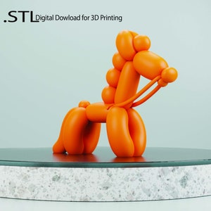 May include: An orange balloon animal dog sculpture, a digital download for 3D printing. The dog is posed in a standing position on a black and white speckled platform, with a light blue background. The text ".STL Digital Download for 3D Printing" is in the upper left corner.