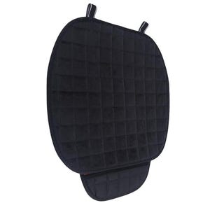 May include: Black quilted seat cushion with straps. The cushion has a quilted design and a black fabric cover.