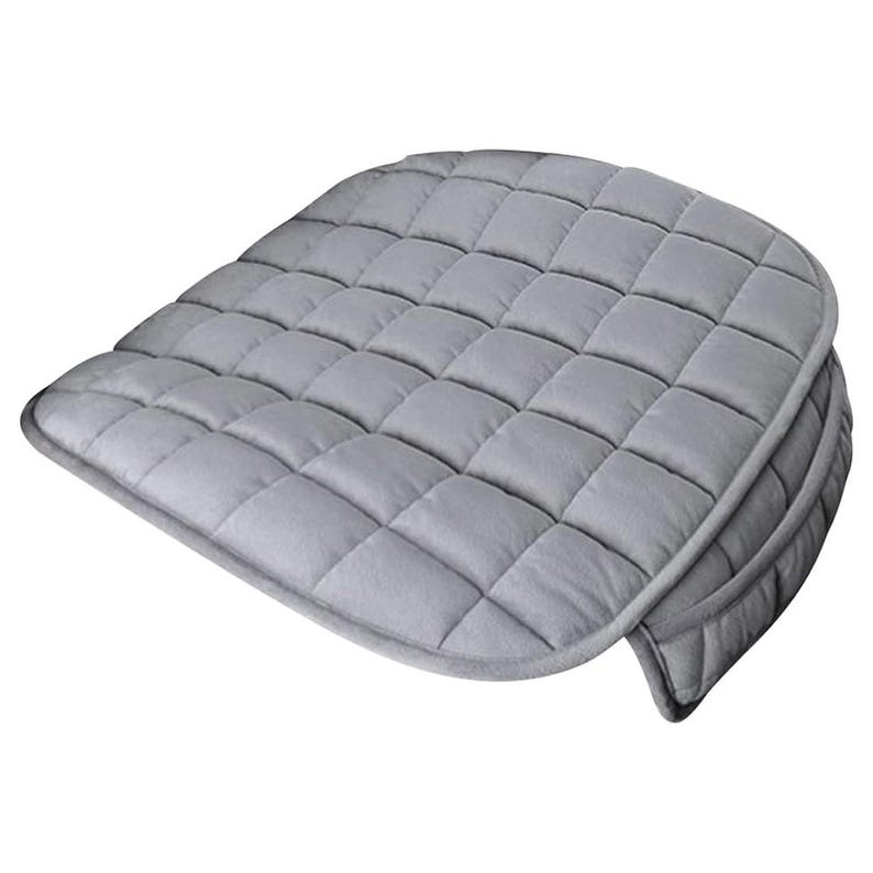 May include: A grey quilted seat cushion with a rounded shape and a thick, padded design.