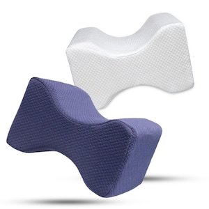 May include: Two knee pillows, one white and one deep blue. Both have a curved shape and a quilted texture. These pillows are designed to be placed between the knees for support and comfort, often used for side sleeping.