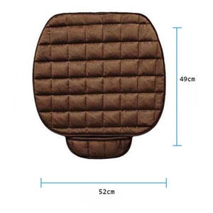 May include: Brown quilted seat cushion with a rectangular shape. The cushion measures 52 cm wide and 49 cm high.