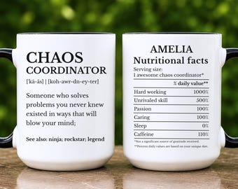 May include: A white ceramic mug with a black handle and interior. The front features the text Chaos Coordinator with a definition and phonetic spelling. The back displays Amelia Nutritional facts with a list of traits and percentages.
